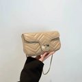 Chic beige quilted crossbody bag with V-shaped wave pattern and gold chain strap - Khaki