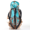 Lake blue leopard and chain print silk-like scarf 90x90cm on a mannequin head - Lake Blue