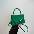 Dark green croc-embossed crossbody bag with gold metal trim and adjustable strap - Green