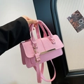 Pink textured minimalist handbag for women with gold clasp and adjustable crossbody strap - Pink