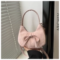 Detail of light pink half-moon bag with bow knot and soft textured finish - Pink