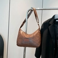 Vintage brown crescent shoulder bag in textured PU leather with Fashion label detail - Brown