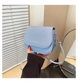 Detail of light blue textured saddle bag with FASHION & TREND print and metal buckle - Blue