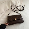 Dark brown woven textured crossbody bag with gold buckle and stylish knot strap - Brown
