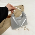 Silver metallic dumpling bag with pearl handle and golden chain strap for women - Silver