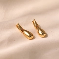 Modern gold-plated irregular teardrop earrings set on beige textured fabric - Gold Waterdrop Style