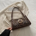 Leopard print underarm bag with vintage saddle buckle and dark brown strap - Brown