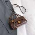 Retro dark brown crossbody bag in oily PU leather with gold bell charm and turn-lock - With Pendant / Brown