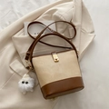 Beige canvas and brown leather bucket bag with gold buckle and plush monster charm - With Pendant / Brown