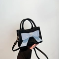 Elegant black handbag with pleated texture and light blue bow featuring a heart rhinestone - Black