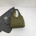 Dark green quilted puffer tote bag with square stitching and minimalist padded texture - Green