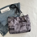 Gray tote bag with black newspaper print and silver chain strap for streetwear style - Purple
