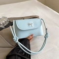 Light blue crossbody square bag with metallic bow buckle and rope style strap - Matte Blue