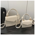 Detailed comparison of large and mini white leather handbags with elegant knot handles - Large / White