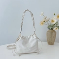 Minimalist cream white drawstring bucket bag with a wide woven shoulder strap detail - No Pendant / Off White