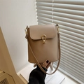 Chic beige bucket crossbody bag with gold shell clasp and sleek minimalist design - Khaki