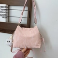 Pink drawstring bucket bag with pleated texture and cute white plush monster charm - With Pendant / Pink