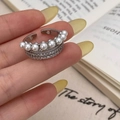 Close-up of triple-layered adjustable ring with white pearls and sparkling cubic zirconia - Silver Multi-layer Zirconia Pearl Open Ring