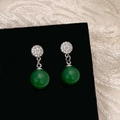 Detailed close-up of emerald green round bead earrings with micro-pave zircon crystals - Green Chalcedony Pave Zircon Silver Studs