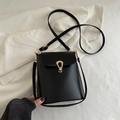 Minimalist black matte PU leather bucket bag with elegant golden U-shaped buckle - Black