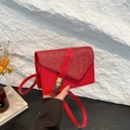 Chic red glitter leather crossbody bag for women featuring a gold metallic clasp - Red