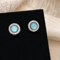 Macro shot of silver stud earrings with light blue stone and white zircon halo detail - Silver Micro-set Zirconia Cat's Eye Stone (Light Blue)