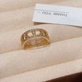 Macro detail of gold-plated zircon ring with double-layered hollow musical note design - Gold Dewdrop Ring