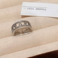 Close-up of silver hollow ring with double-row micro-set zircons in a jewelry box - Silver Dewdrop Ring