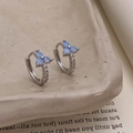 Close-up of silver hoop earrings featuring blue opal flowers and micro-set diamonds - Silver With Blue Flower (Synthetic Opal)