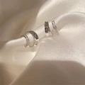 Macro view of silver hoop earrings featuring polished metal and pavé zircon settings - Silver Double Layer Zircon Earrings (Real Gold Plated)