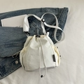 Creamy nylon drawstring bucket bag with adjustable strap and side mesh pocket - White
