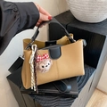 Chic khaki pebbled leather tote bag with black handles and cute plush charm detail - Khaki With Pendant