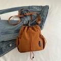 Brown drawstring bucket bag with mesh side pockets and adjustable nylon strap for casual wear - Brown