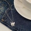 Minimalist silver chain necklace featuring a white shell cat pendant on denim background - White Cat Shape / White