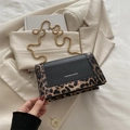 Retro leopard print crossbody bag with gold chain strap on minimalist blazer - Brown