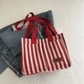 Elegante borsa tote in tela a righe rosse e bianche con tasche anteriori e tracolla - Rosso