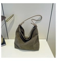 Detail of dark olive green matte suede hobo bag with unique knotted strap design - Green