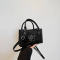 Glossy black mini square bag with heart ribbon detail and detachable shoulder strap - Black