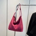 Fuchsia suede hobo bag with knotted shoulder strap detail in a minimalist slouchy style - Red