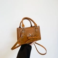 Brown vintage square handbag with heart strap and bow detail, shown with top handle - Brown