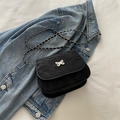 Black pleated crossbody bag with silver butterfly charm and metal chain strap - Black
