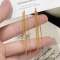 Sparkling long gold tassel earrings with multilayered delicate chain drop design - Gold