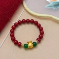 Red beaded bracelet with green accents and golden fortune bag pendant with Fu character - Red Pearl Lucky Bag Bracelet (B-493)