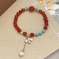 Beaded bracelet with turquoise and red carnelian beads featuring a golden bee charm - Freshwater Pearl Bee Pendant Bracelet (D-37)