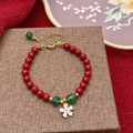 Elegant beaded bracelet with red pearls, green accents and a zircon flower charm - Zirconia Flower Pendant Red Pearl Bracelet (D-115)
