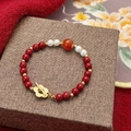 Beaded bracelet with red carnelian, white pearls, and a gold flower toggle clasp - Red Pearl Small Flower Buckle Bracelet (D-107)