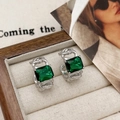 Detail of vintage silver earrings with square emerald green zircon in a jewelry box - Silver Green Zircon Earrings