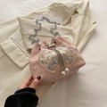 Pink embroidered silk bucket bag with floral patterns and pearl drawstring charms - Pink