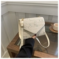 Detail of cream straw bag featuring delicate floral embroidery and gold hardware - Off White