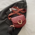 Dark red saddle bag with gold U-shaped hardware and jacquard wide shoulder strap - Red